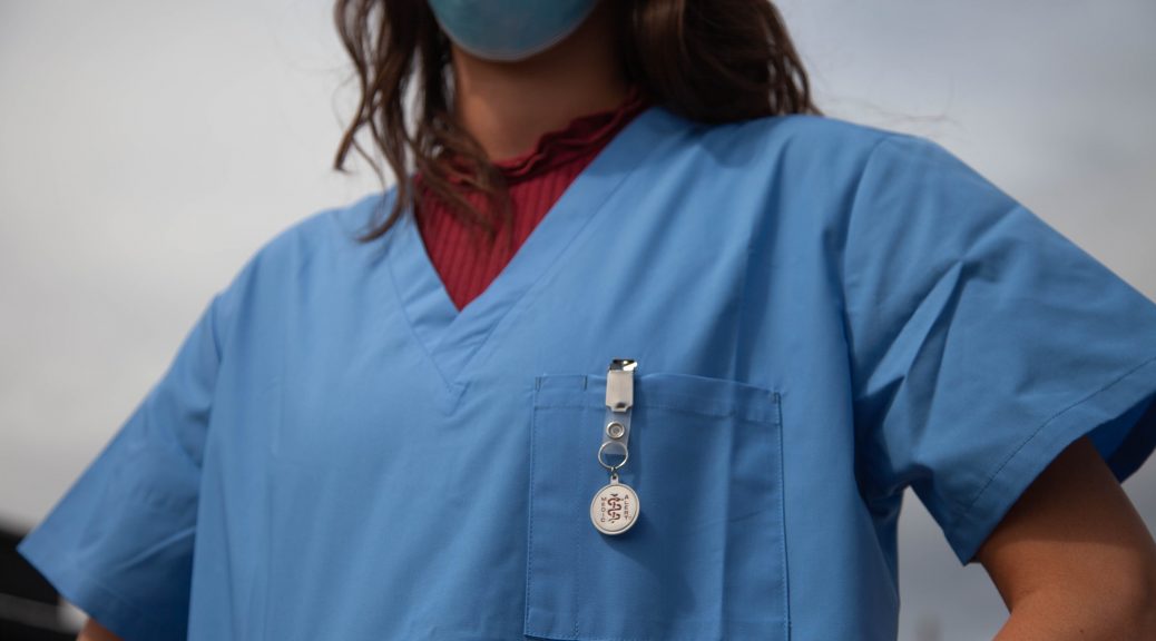 lady doctor in scrub suit and mask
